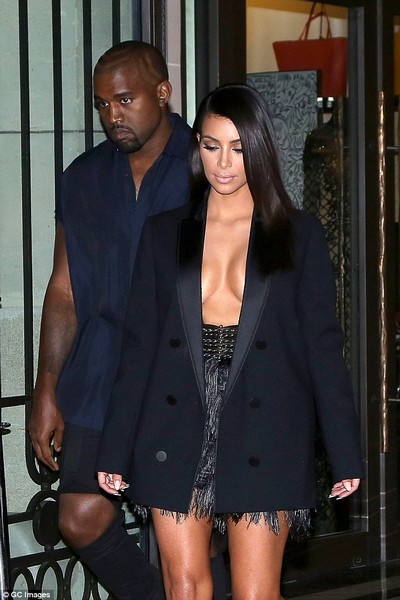 Kim Kardashian appears topless under open tuxedo jacket  